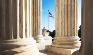 Supreme Court Pillars with American Flag