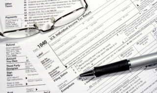 Closed up of US Tax form 1099 with a pen laying accross the document.jpg